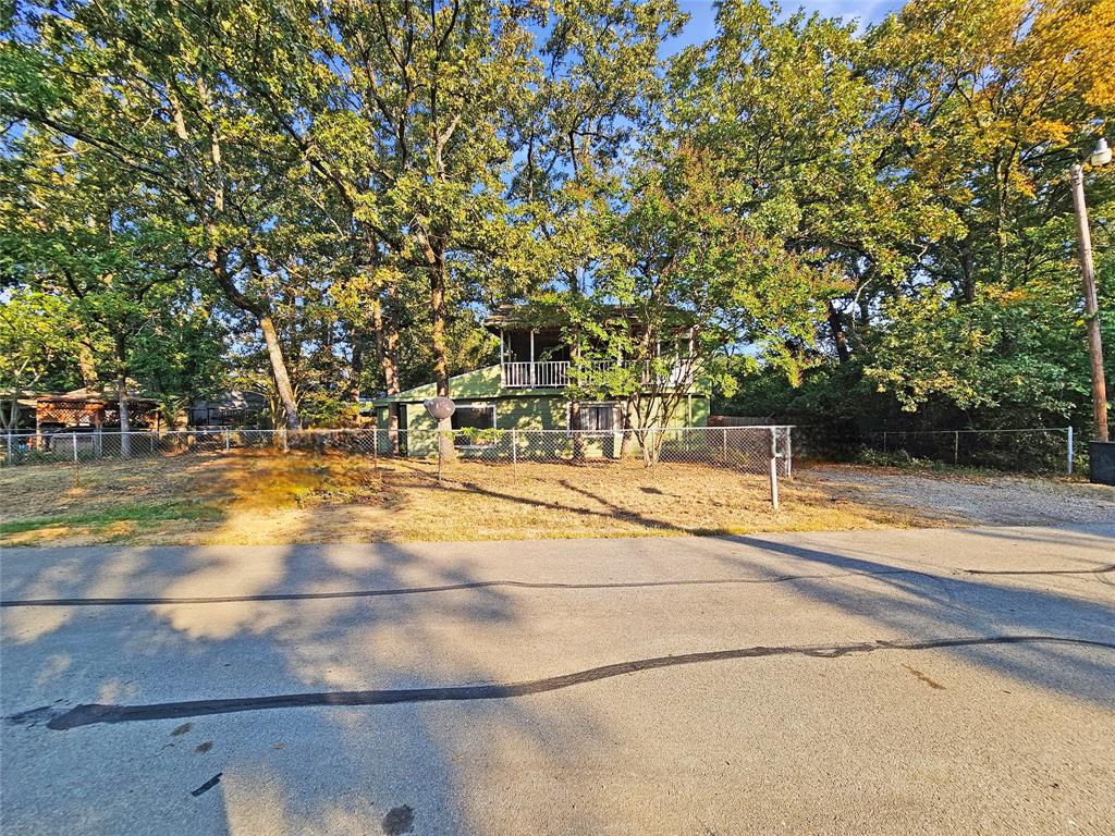 709 Cedarcrest Drive Tool, TX 75143 - Photo 6 of 15 a view of a yard with basketball court