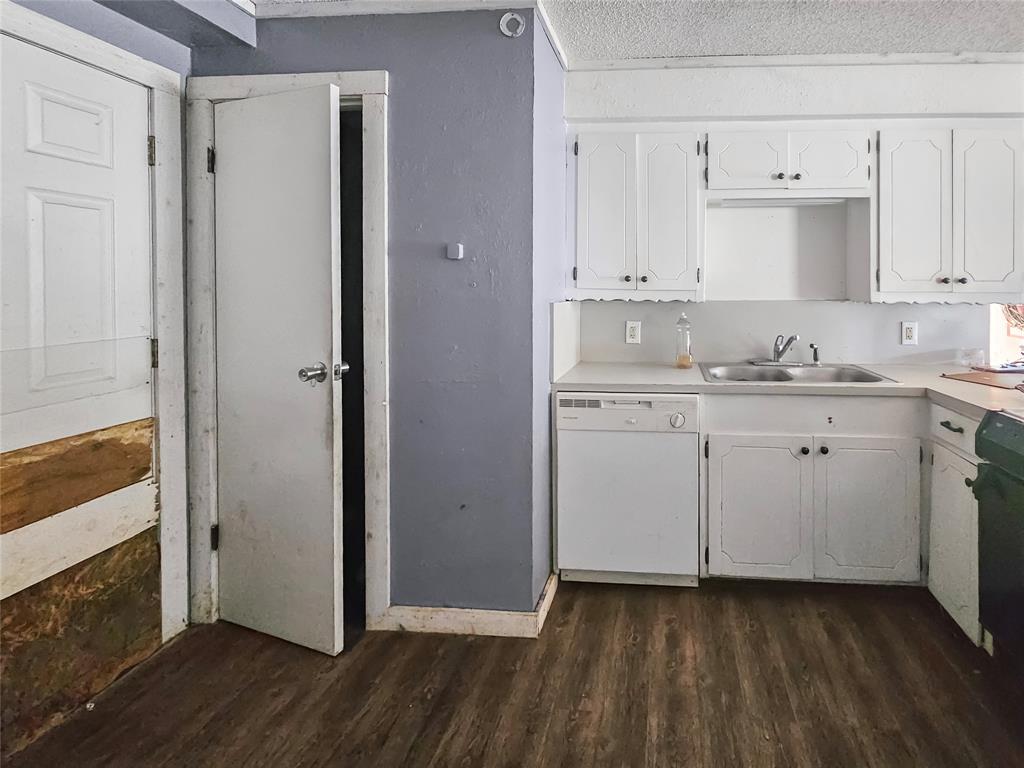 709 Cedarcrest Drive Tool, TX 75143 - Photo 9 of 15 a kitchen with a sink cabinets and wooden floor