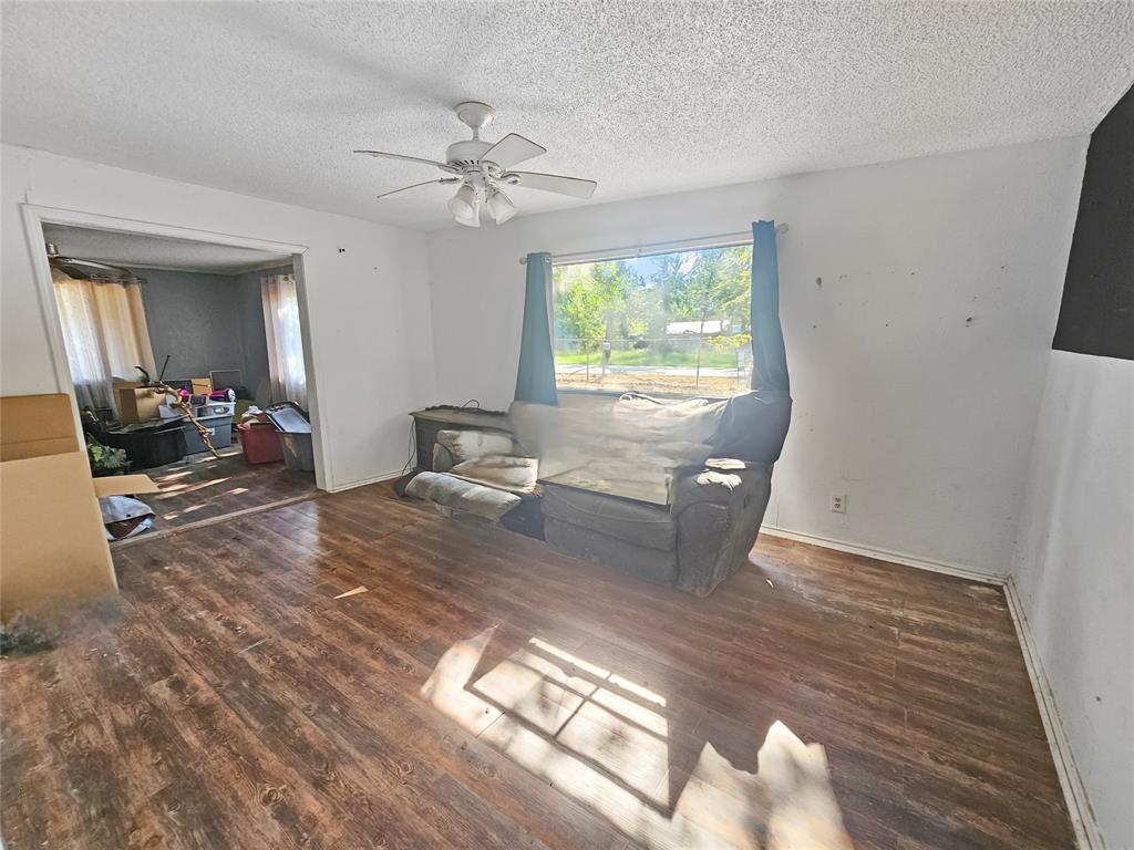 709 Cedarcrest Drive Tool, TX 75143 - Photo 10 of 15 a view of a livingroom with furniture window and wooden floor