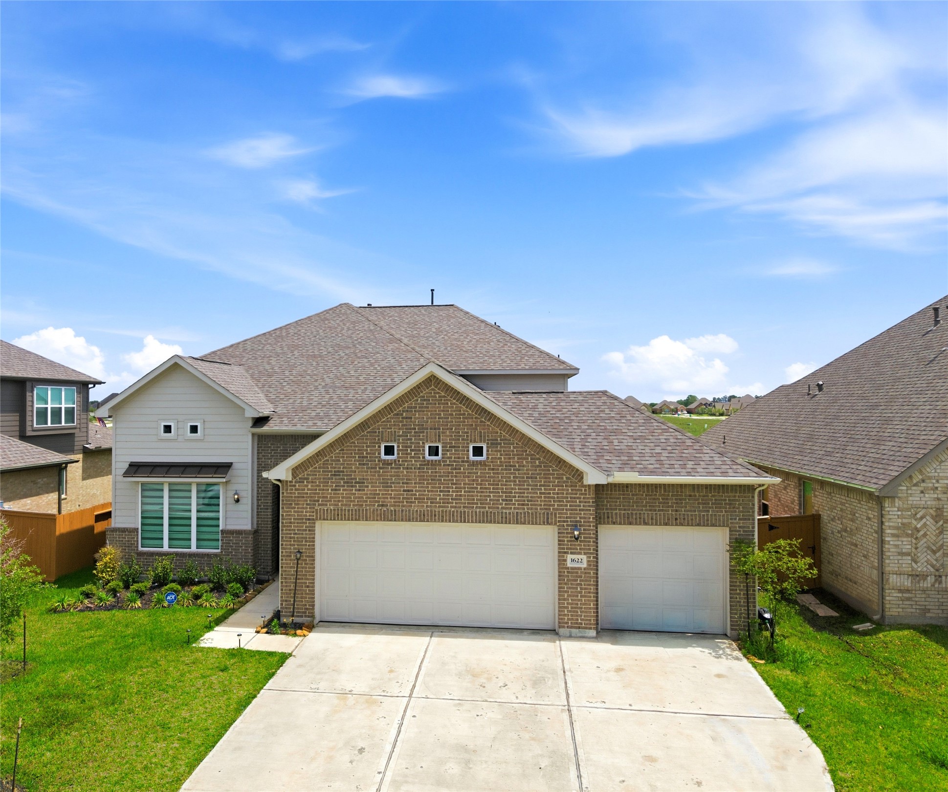 1622 Homewood Point Lane Rosharon, TX 77583 - Photo 1 of 41 a front view of a house with a yard and garage