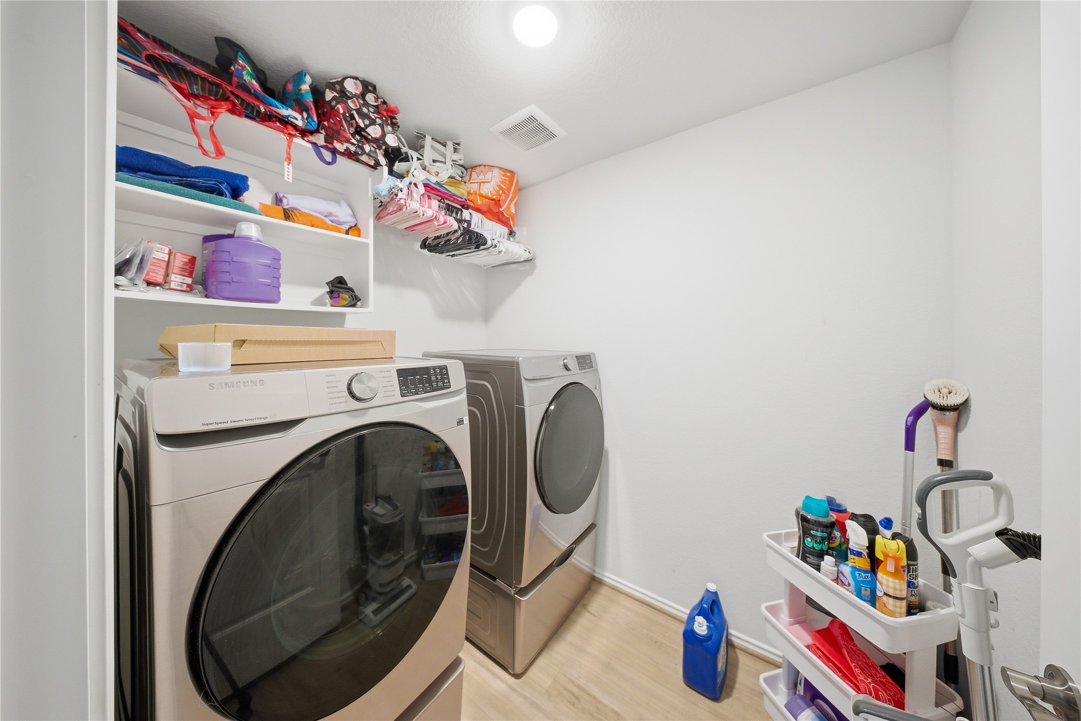 1622 Homewood Point Lane Rosharon, TX 77583 - Photo 13 of 41 a utility room with toys and wooden floor