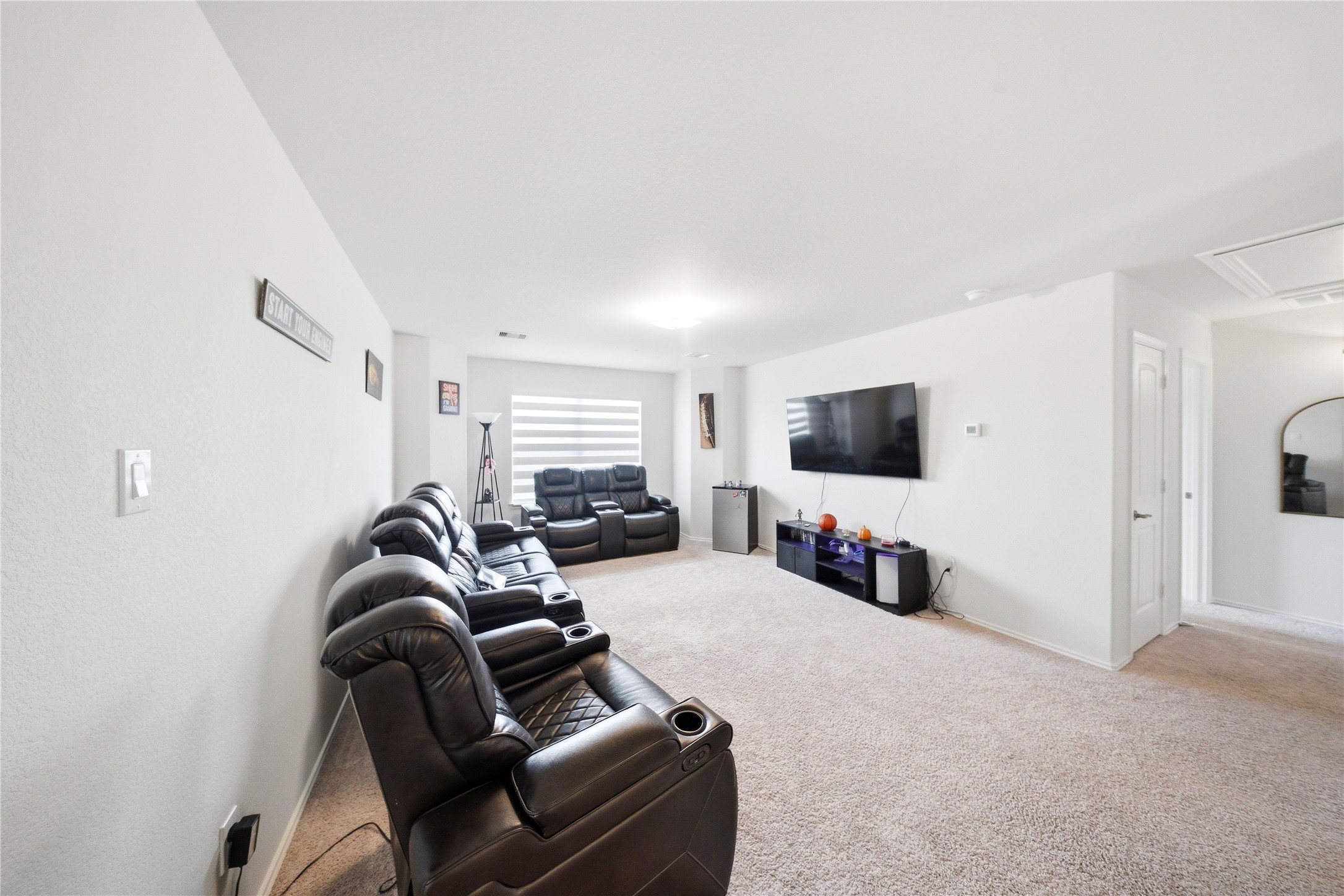 1622 Homewood Point Lane Rosharon, TX 77583 - Photo 19 of 41 a living room with furniture and a flat screen tv
