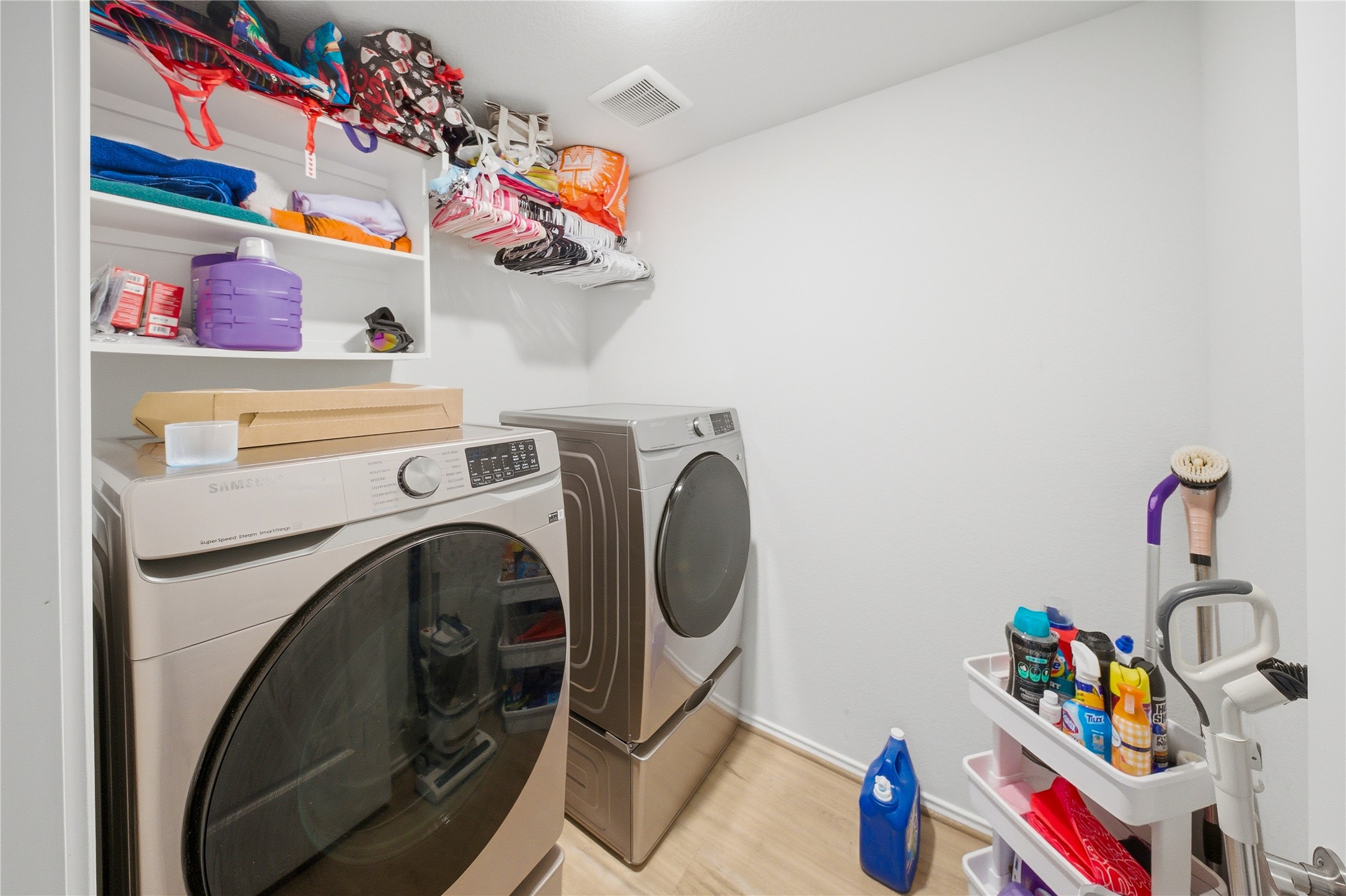 1622 Homewood Point Lane Rosharon, TX 77583 - Photo 23 of 41 a utility room with toys and wooden floor
