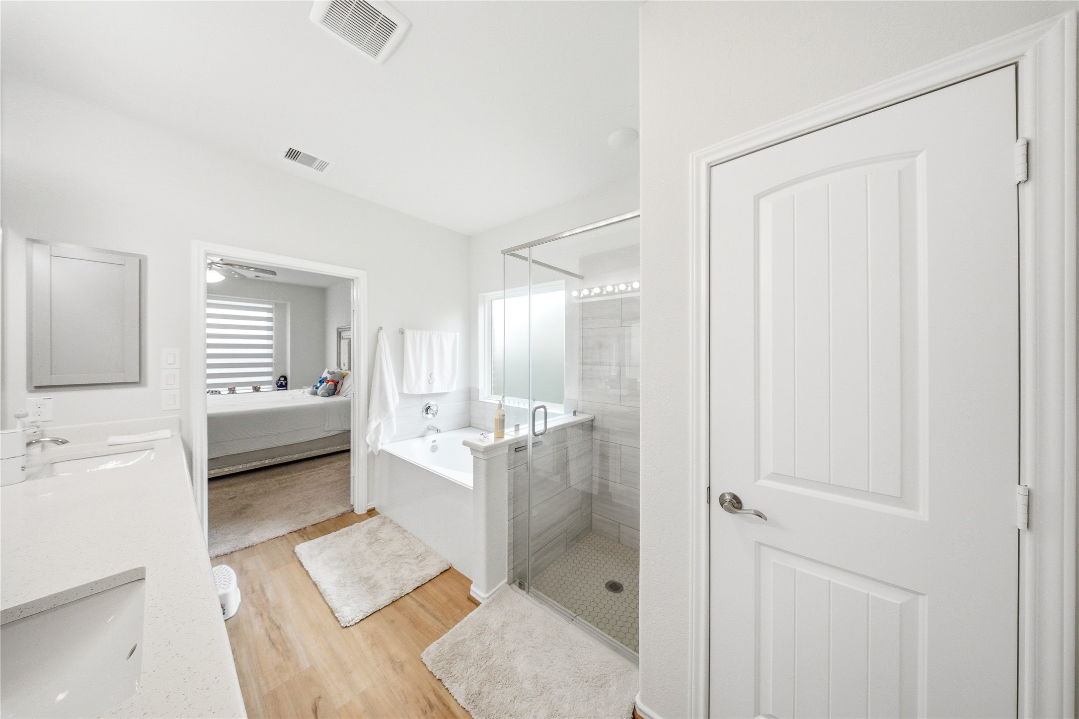 1622 Homewood Point Lane Rosharon, TX 77583 - Photo 31 of 41 a en suite bathroom with a double vanity sink a mirror and a shower