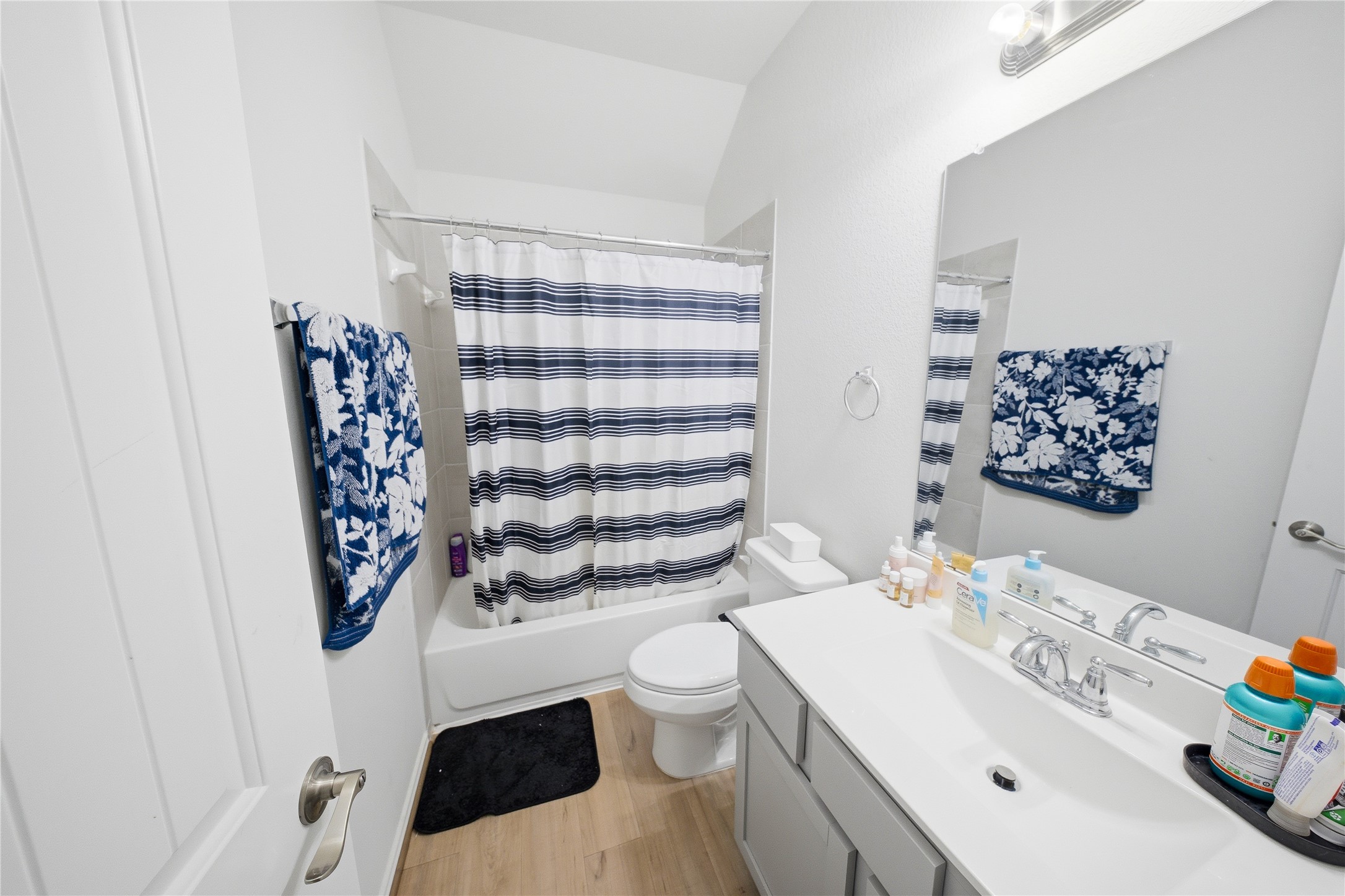1622 Homewood Point Lane Rosharon, TX 77583 - Photo 35 of 41 a bathroom with a sink a toilet and shower curtain