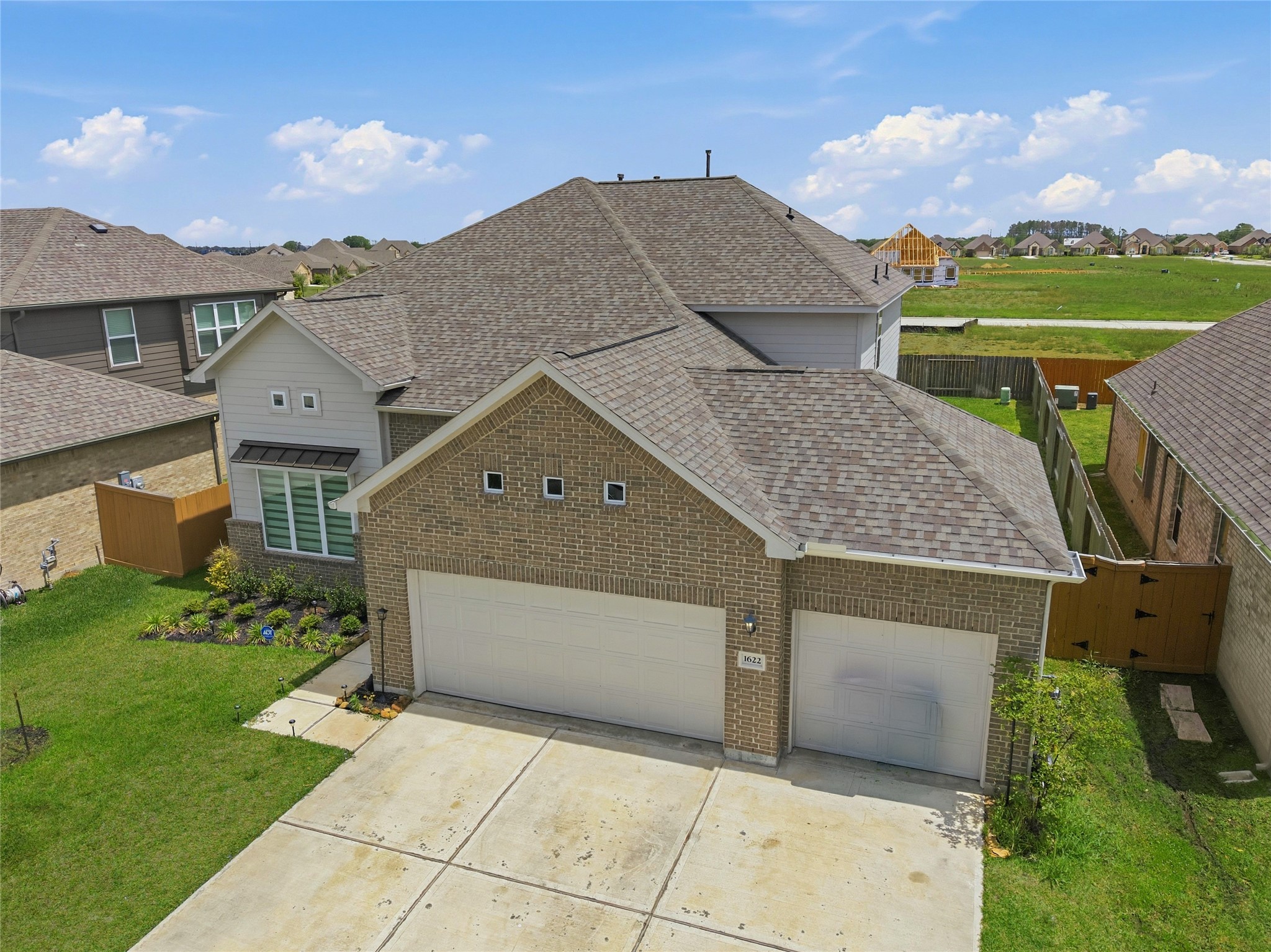 1622 Homewood Point Lane Rosharon, TX 77583 - Photo 4 of 41 a front view of a house with a yard and garage