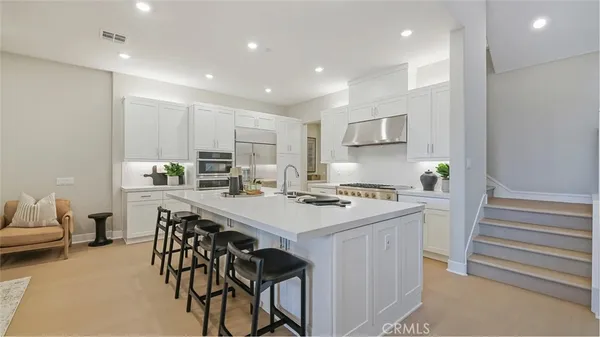 a kitchen that has a cabinets and a stove in it