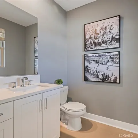 a bedroom with bed and a chandelier