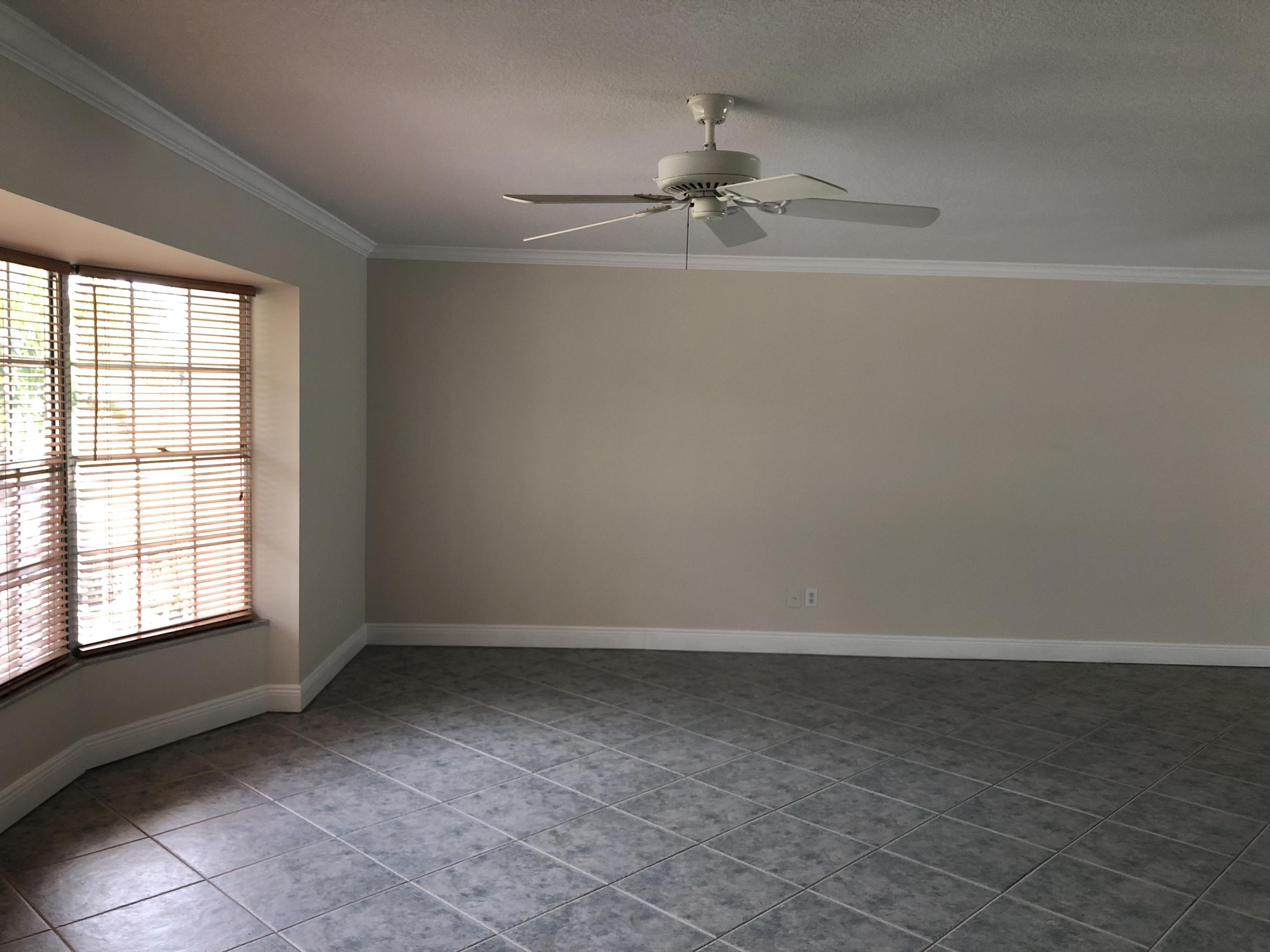 1229 Northwest Fork Road Stuart, FL 34994 - Photo 3 of 25 wooden floor in an empty room with a window
