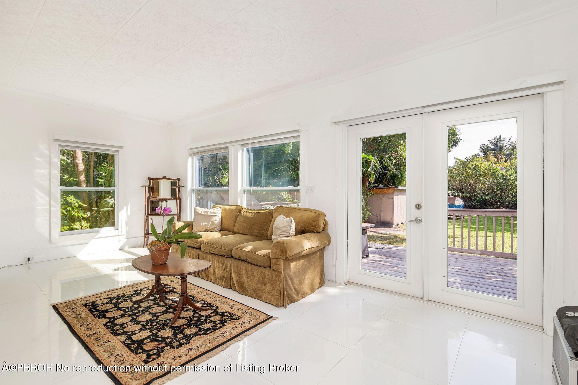 4112 Washington Road West Palm Beach, FL 33405 - Photo 13 of 41 a living room with furniture and a rug