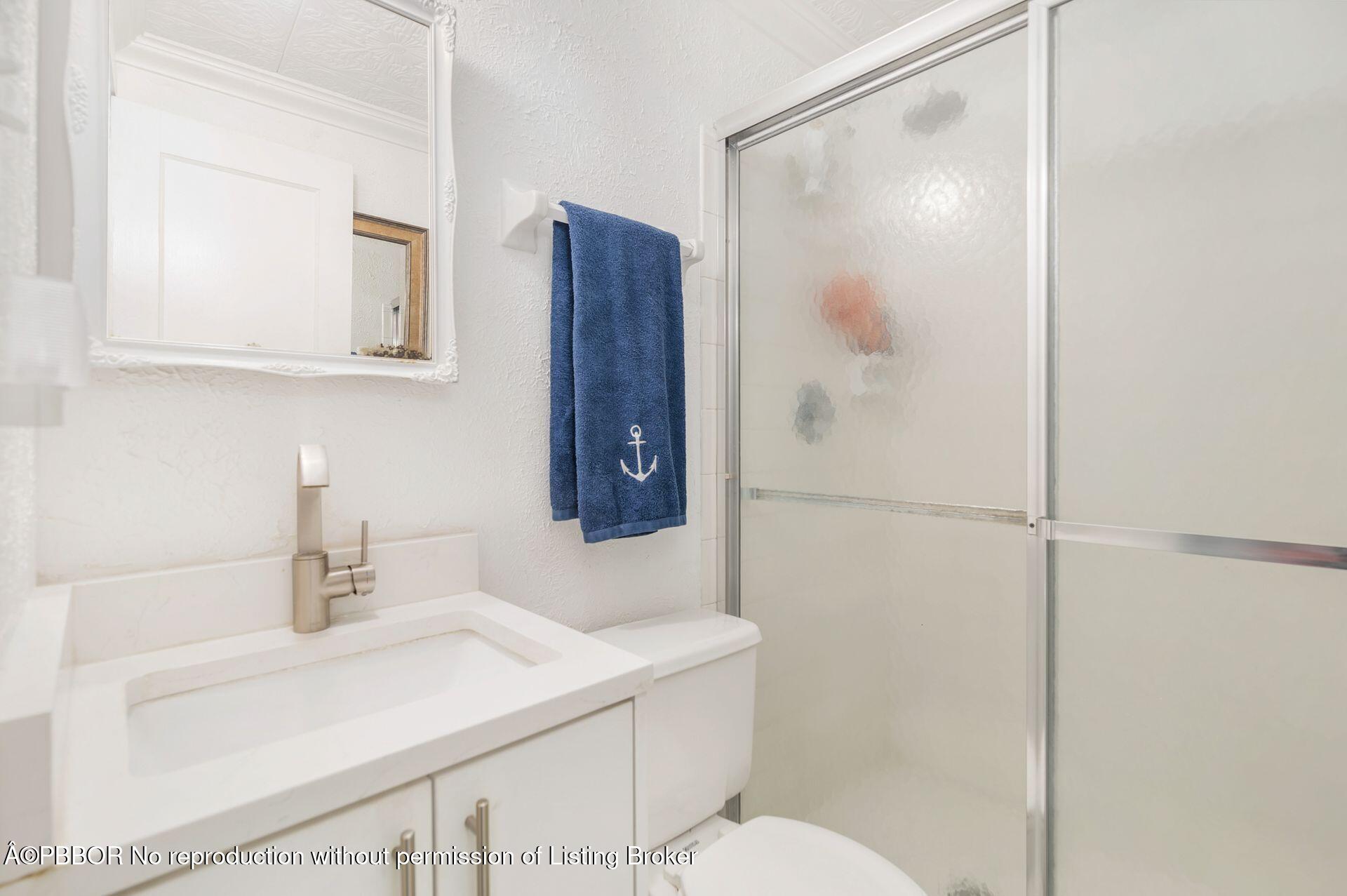 4112 Washington Road West Palm Beach, FL 33405 - Photo 18 of 41 a bathroom with a sink and a mirror