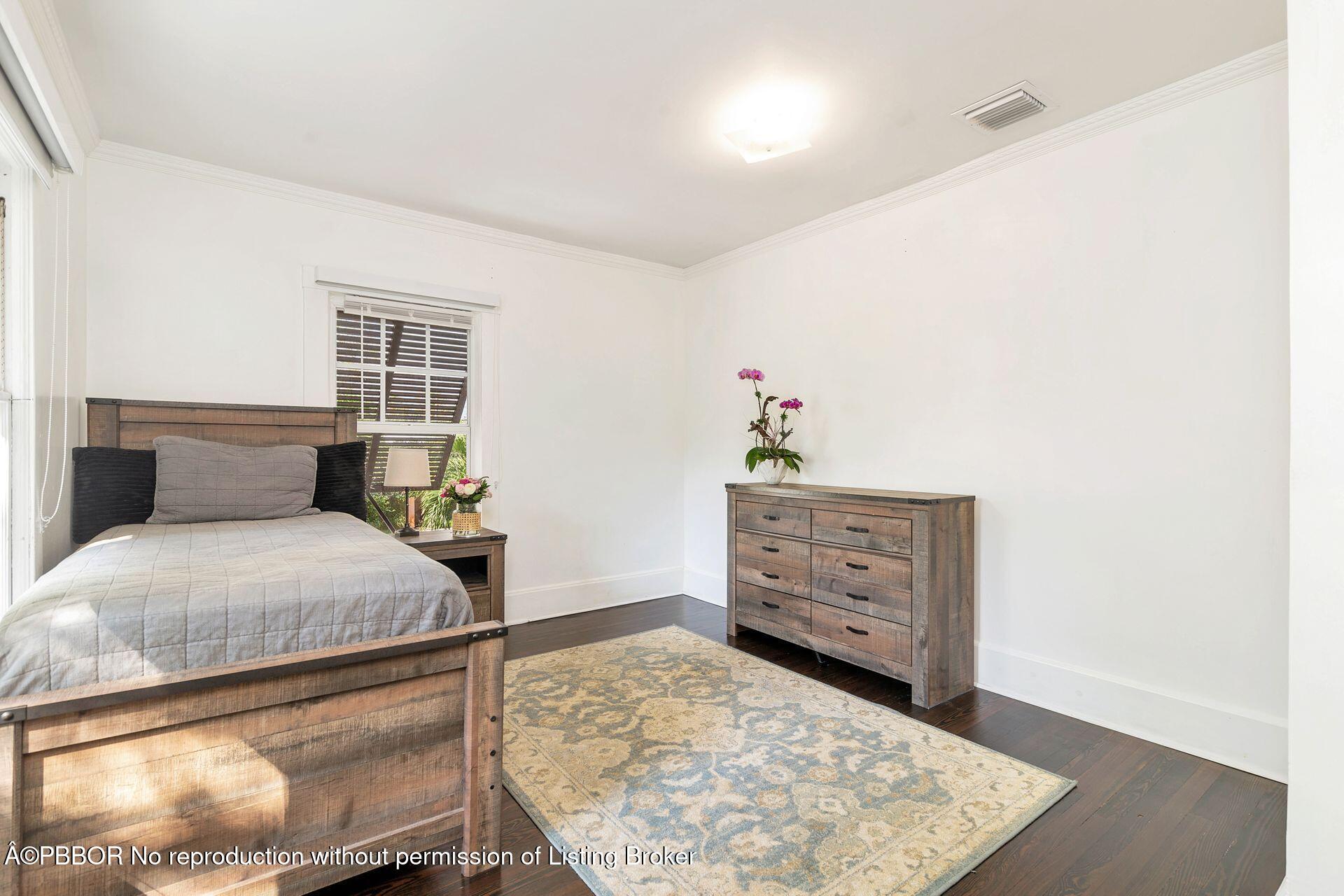 4112 Washington Road West Palm Beach, FL 33405 - Photo 19 of 41 a bedroom with a bed and window