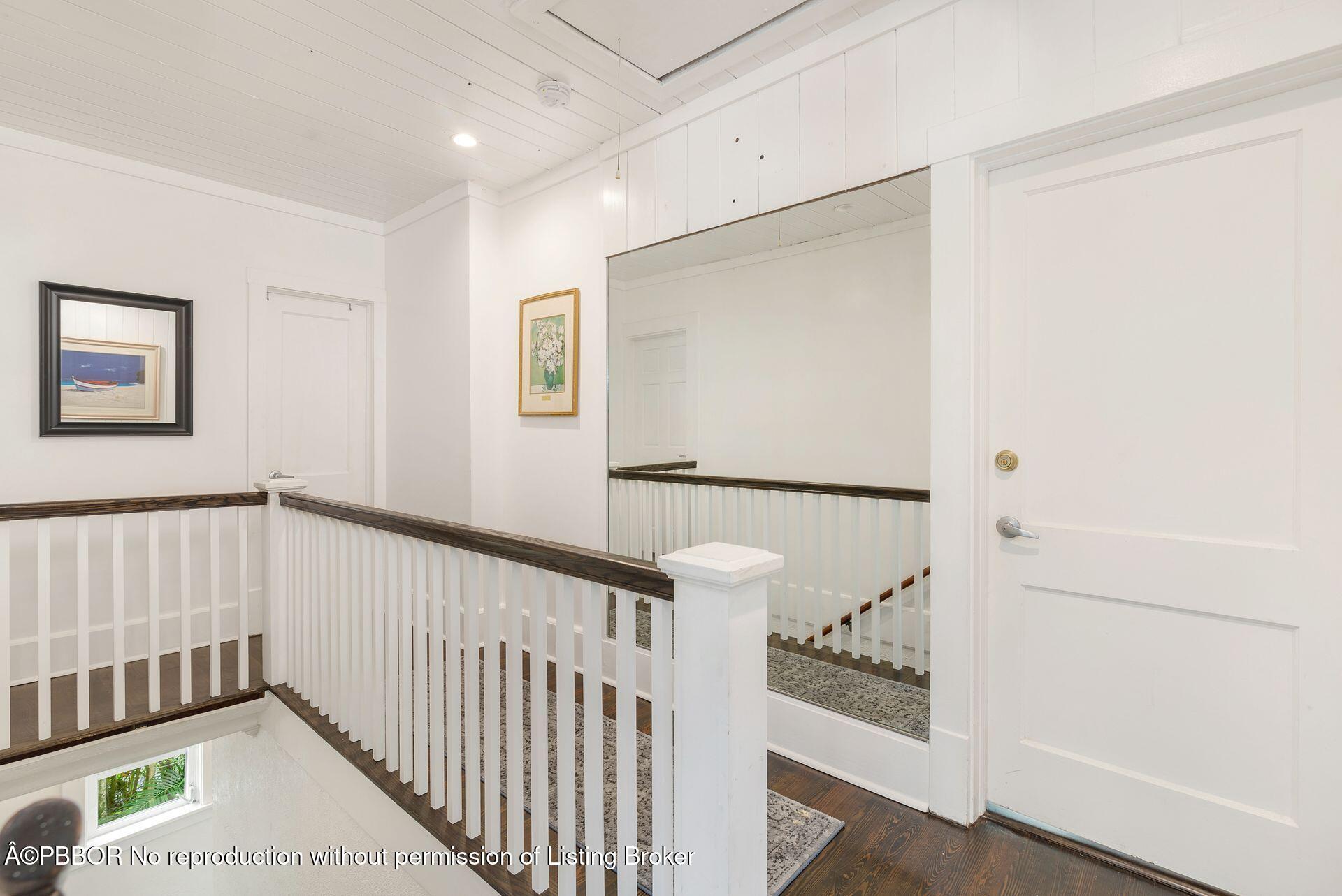 4112 Washington Road West Palm Beach, FL 33405 - Photo 22 of 41 a view of a hallway to a bedroom with wooden floor and windows