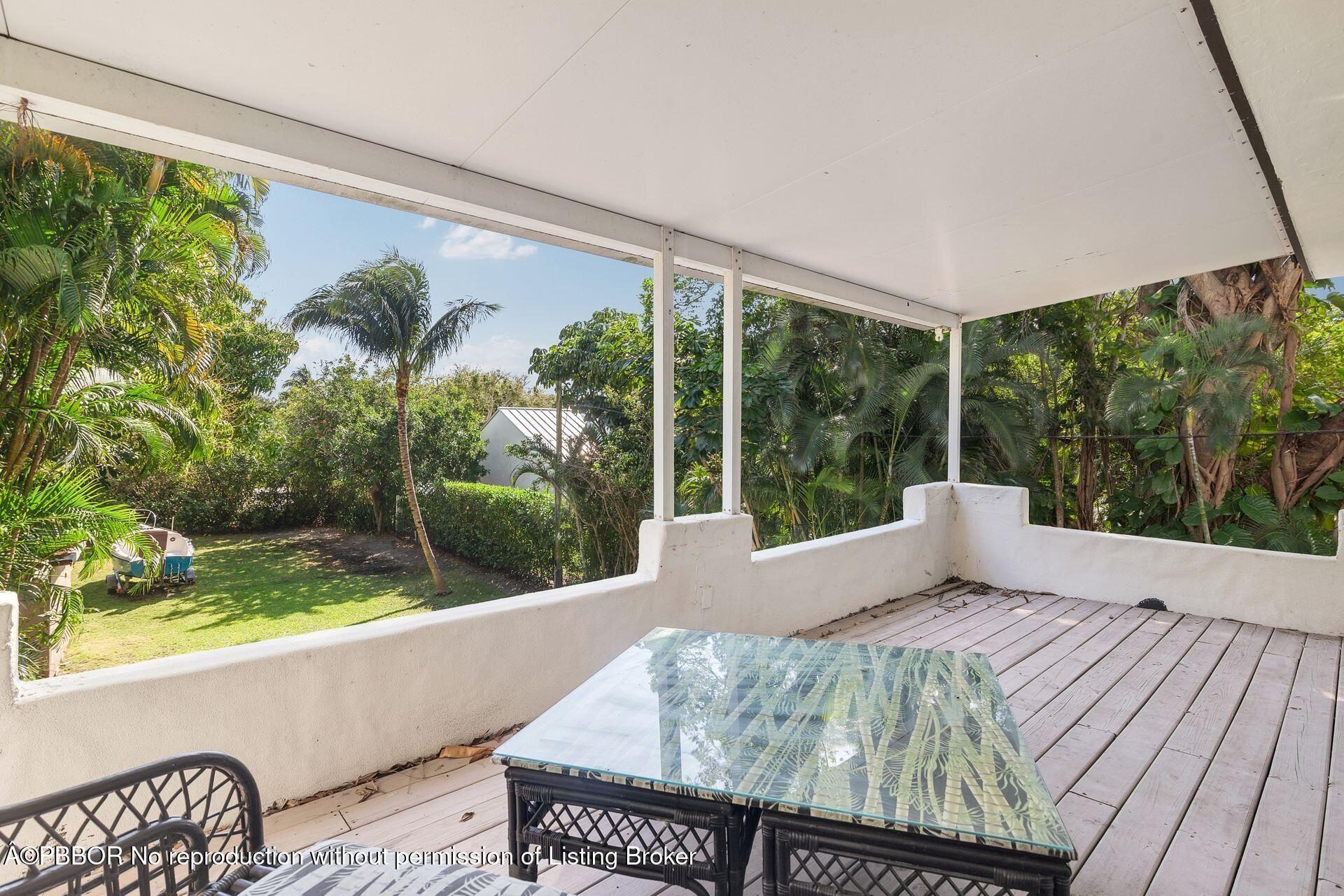 4112 Washington Road West Palm Beach, FL 33405 - Photo 24 of 41 a view of balcony with furniture and garden