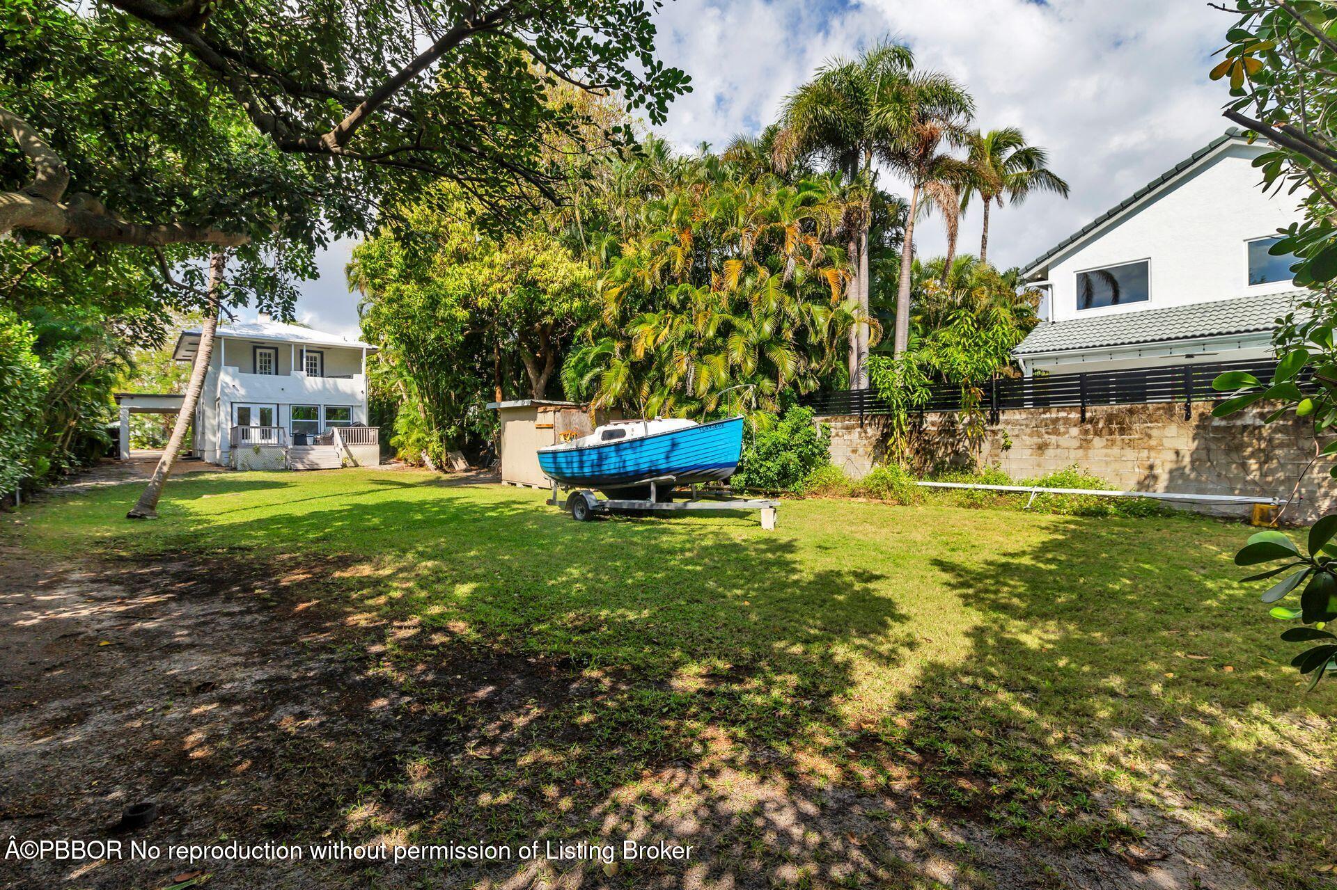 4112 Washington Road West Palm Beach, FL 33405 - Photo 29 of 41 a front view of a house with garden