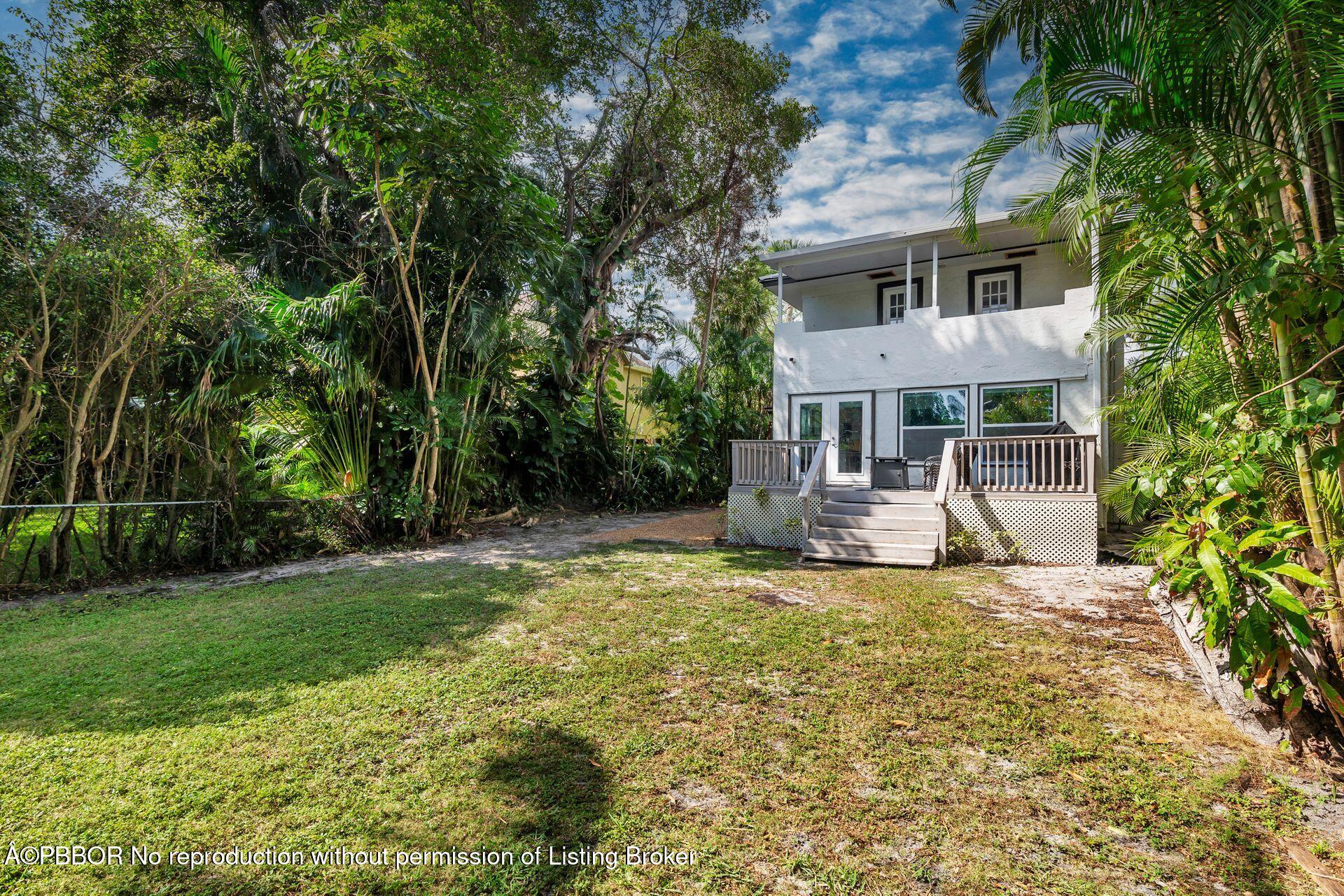 4112 Washington Road West Palm Beach, FL 33405 - Photo 31 of 41 a view of a house with a yard and sitting area