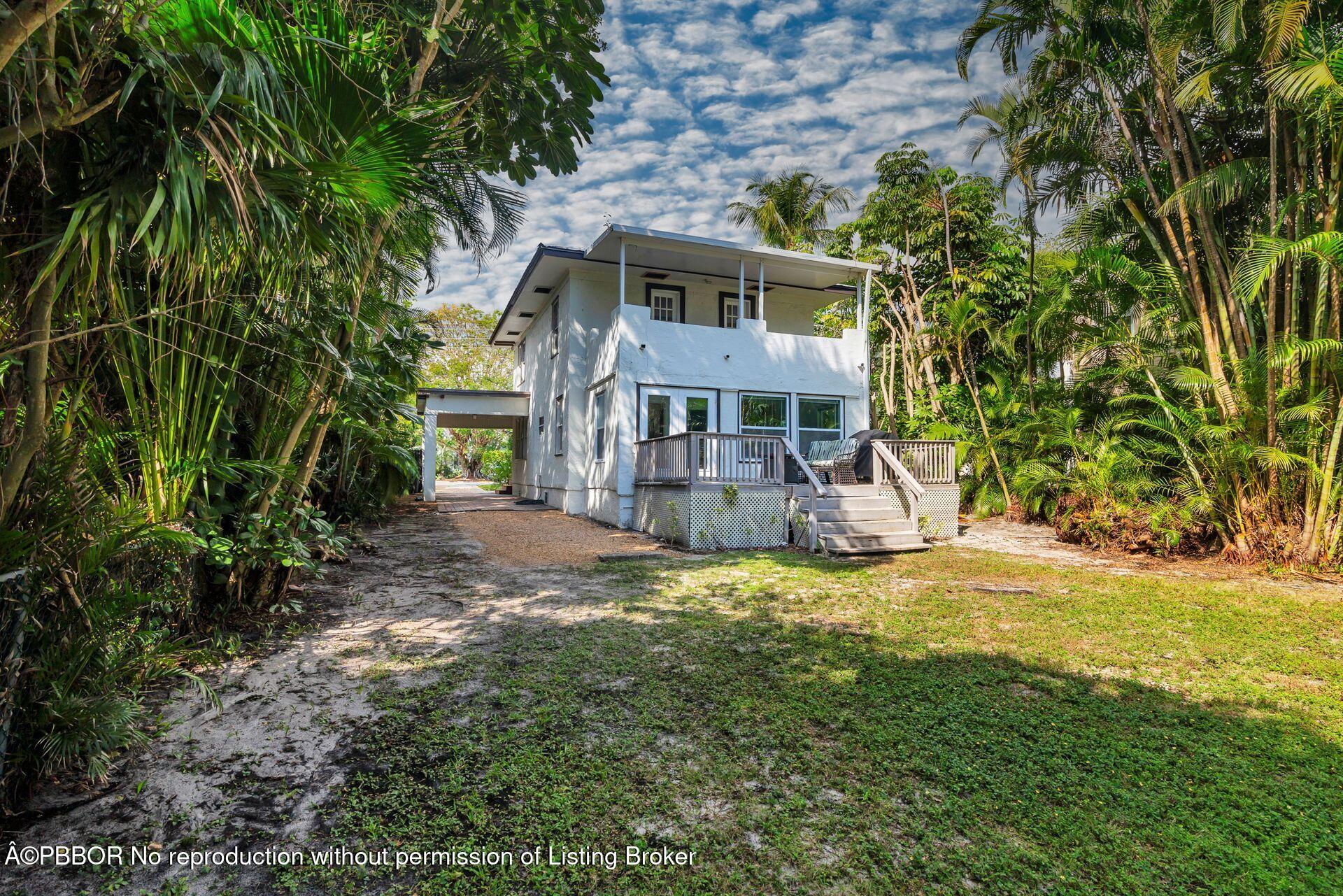 4112 Washington Road West Palm Beach, FL 33405 - Photo 32 of 41 a view of a house with a yard