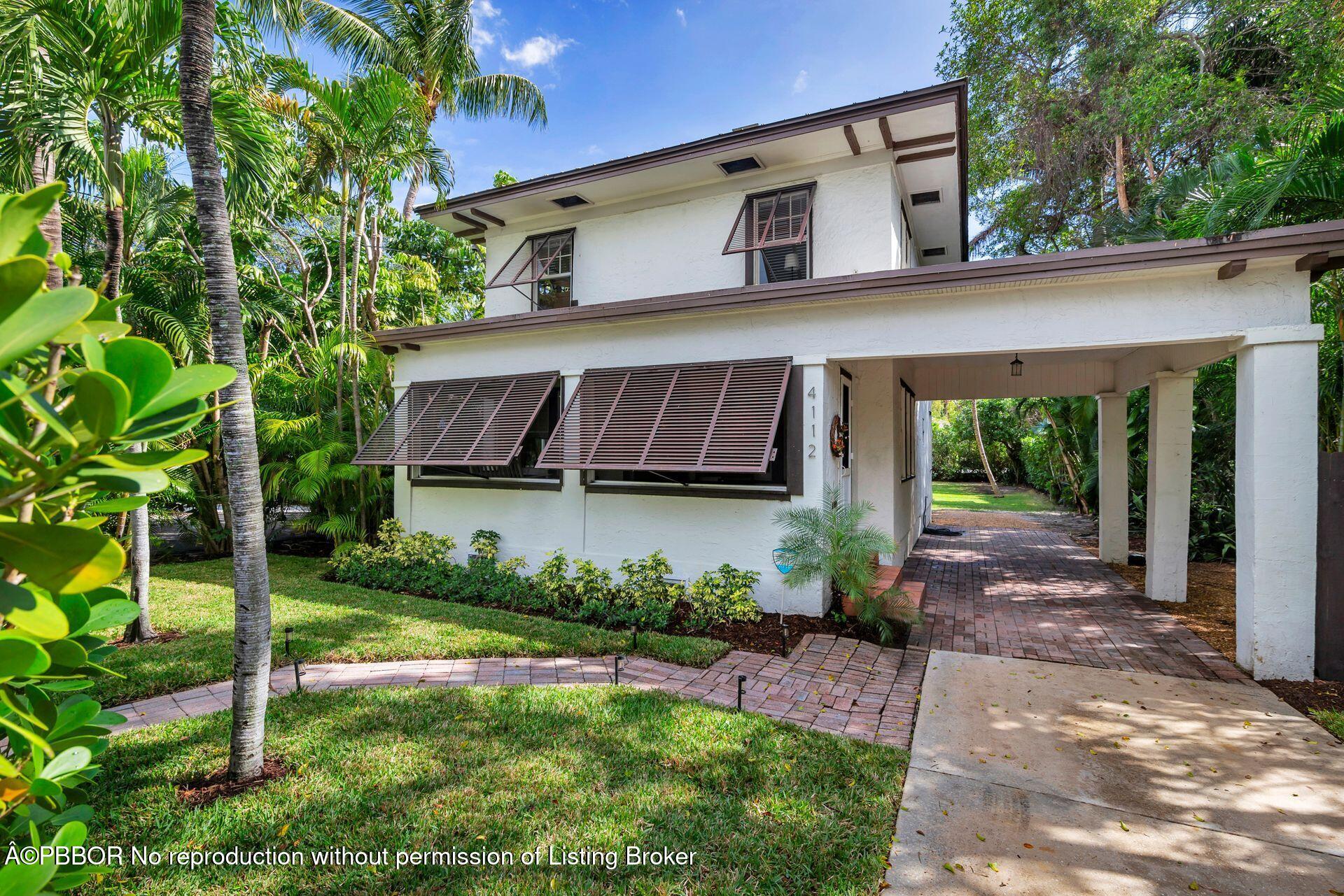 4112 Washington Road West Palm Beach, FL 33405 - Photo 33 of 41 a view of a house with backyard and garden