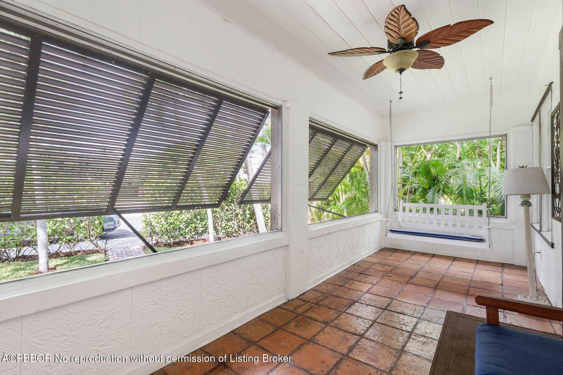 4112 Washington Road West Palm Beach, FL 33405 - Photo 4 of 41 a view of empty room with windows and chandelier