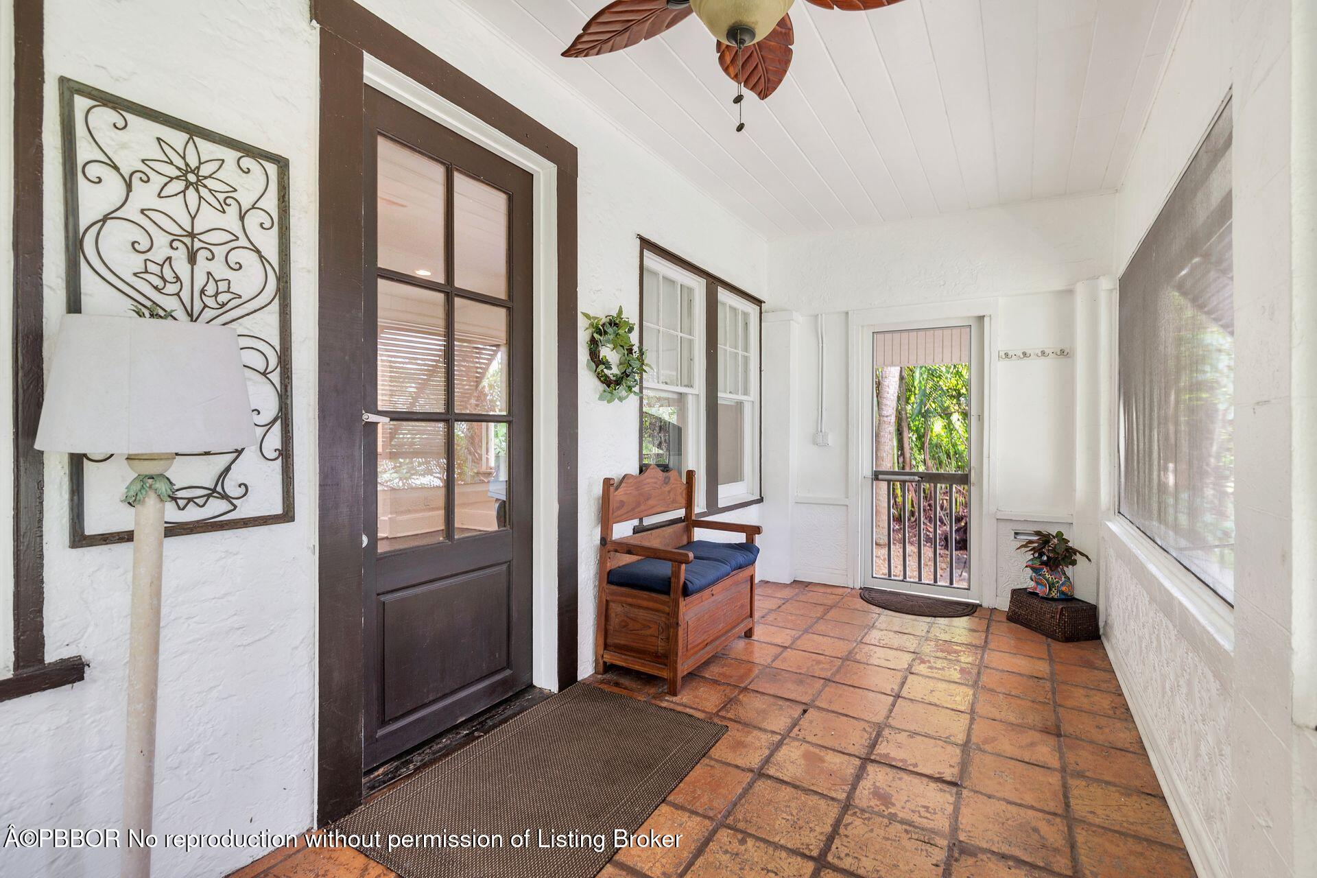 4112 Washington Road West Palm Beach, FL 33405 - Photo 5 of 41 a bedroom with furniture and large window