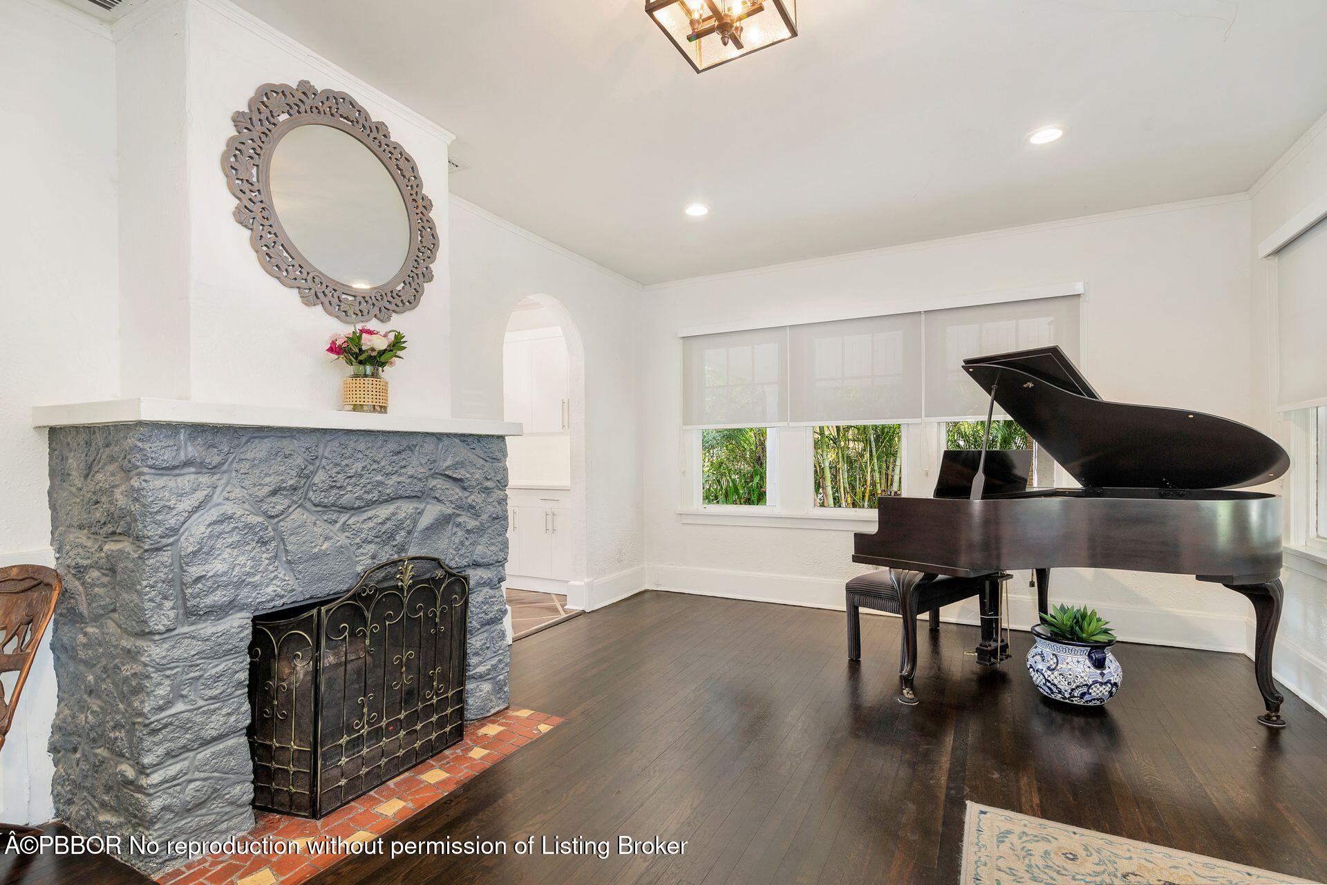4112 Washington Road West Palm Beach, FL 33405 - Photo 9 of 41 a living room with furniture and a fireplace