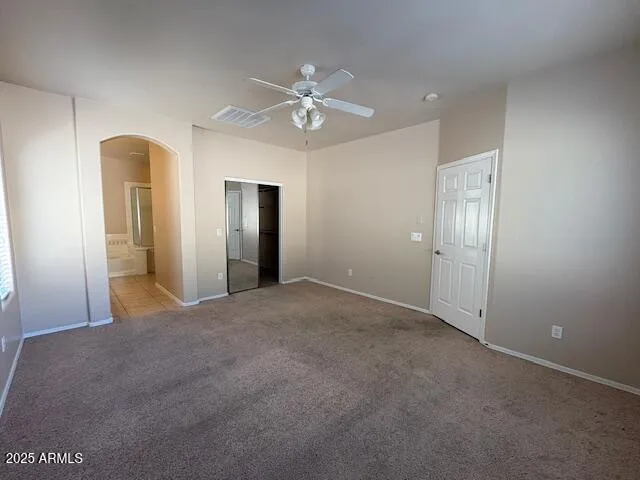 a view of a livingroom with a ceiling fan