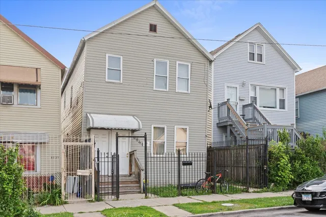 a view of multiple house with a yard
