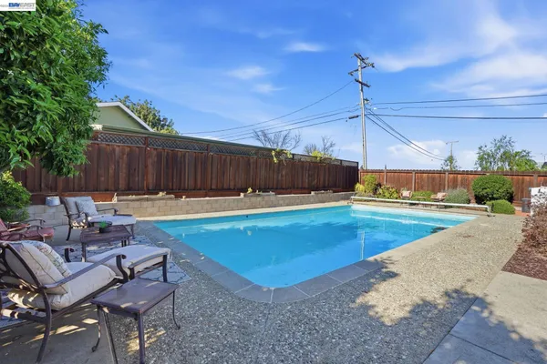 a view of a swimming pool with a lounge chairs