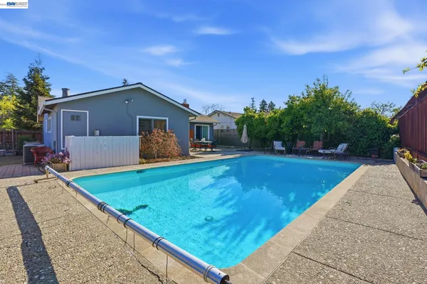 a view of a pool with a yard