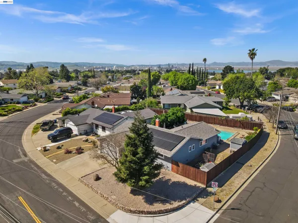 an aerial view of a house with outdoor space