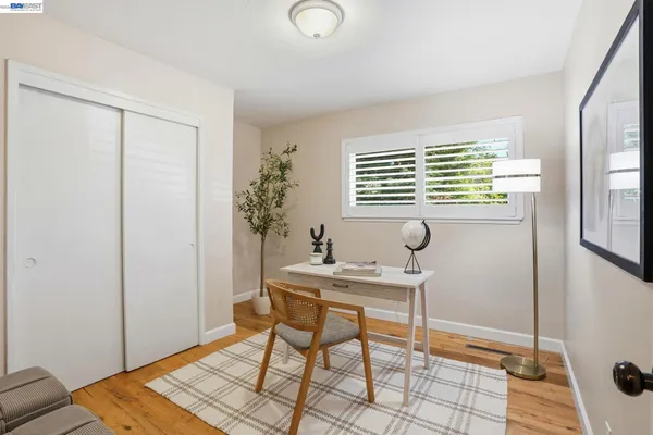 a workspace with furniture and window