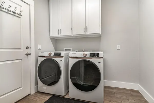 a utility room with dryer and washer