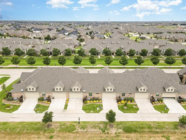 an aerial view of a house with a garden