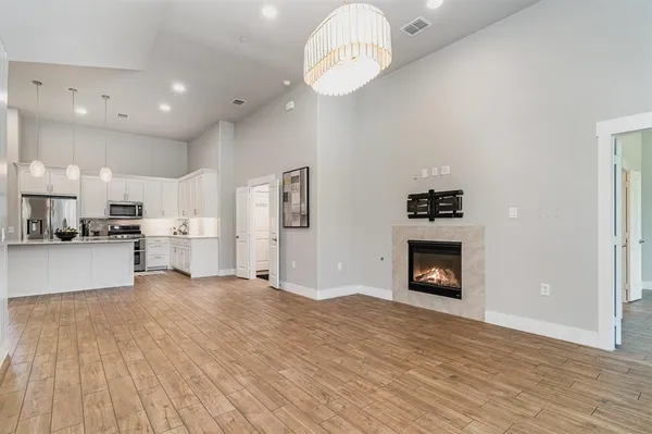 a view of kitchen with furniture and wooden floor