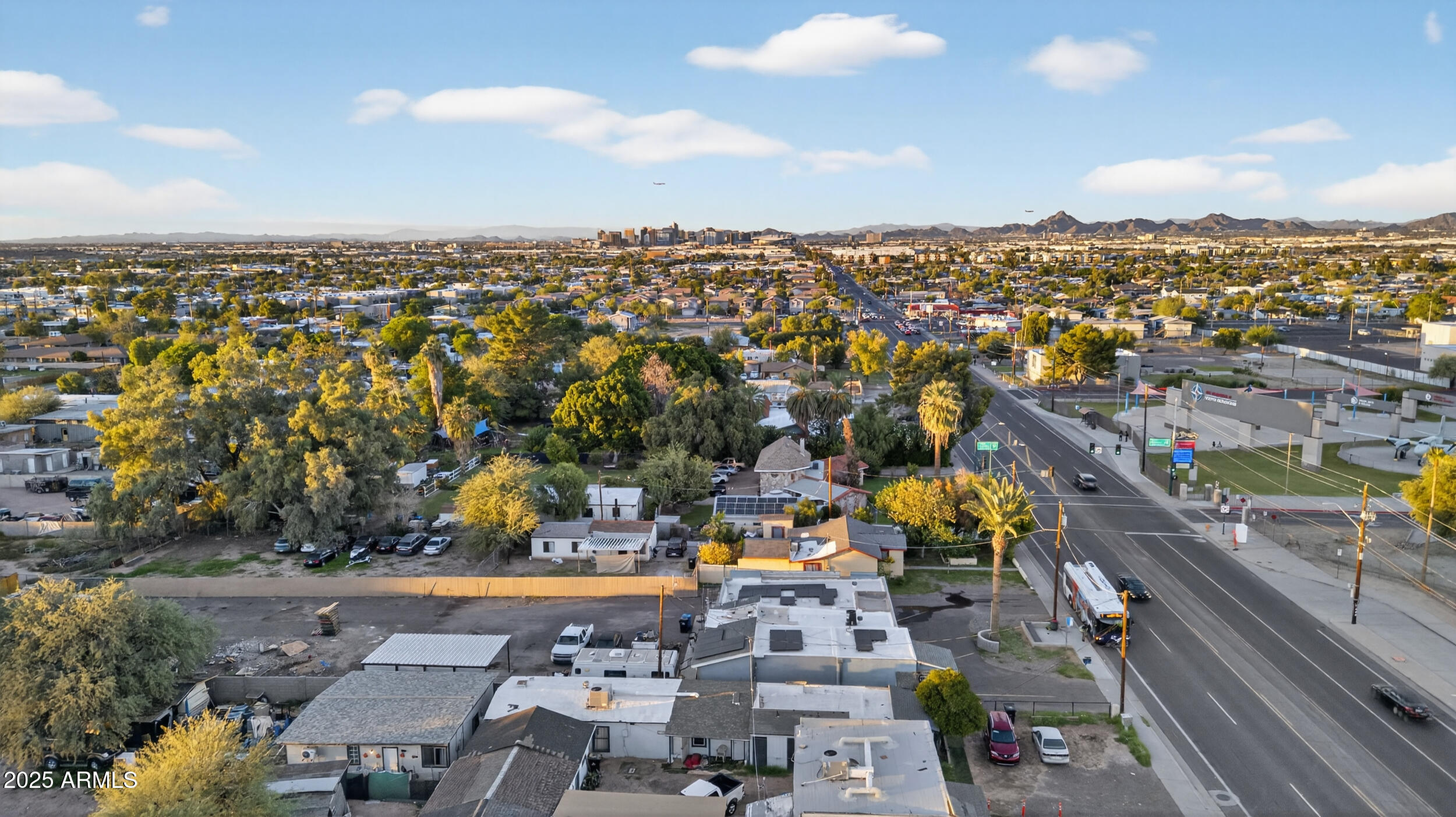 5436 South 7th Street Phoenix, AZ 85040 - Photo 2 of 8 an aerial view of a city with lots of residential buildings