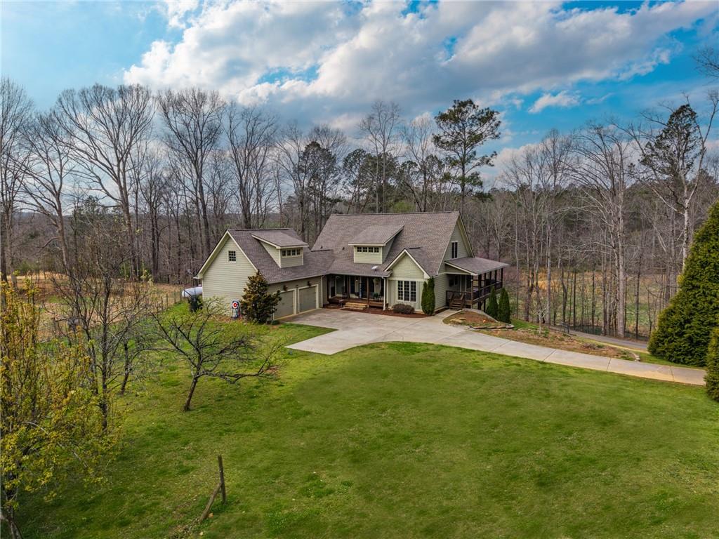723 Sulphur Springs Road Southeast Fairmount, GA 30139 - Photo 36 of 54 an aerial view of a house with swimming pool and big yard
