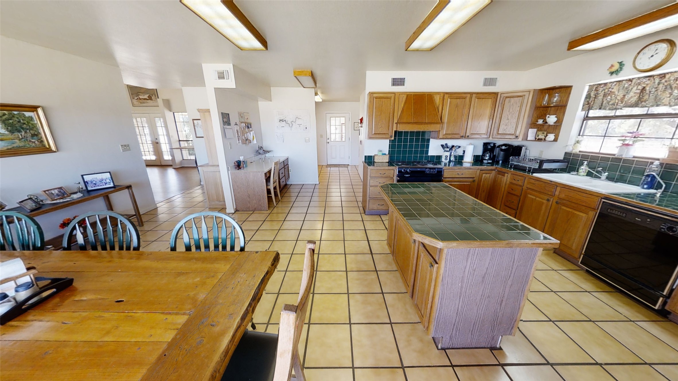 313 Rawhide Road Burnet, TX 78611 - Photo 12 of 17 a living room with stainless steel appliances kitchen island granite countertop a refrigerator a stove a sink and dishwasher