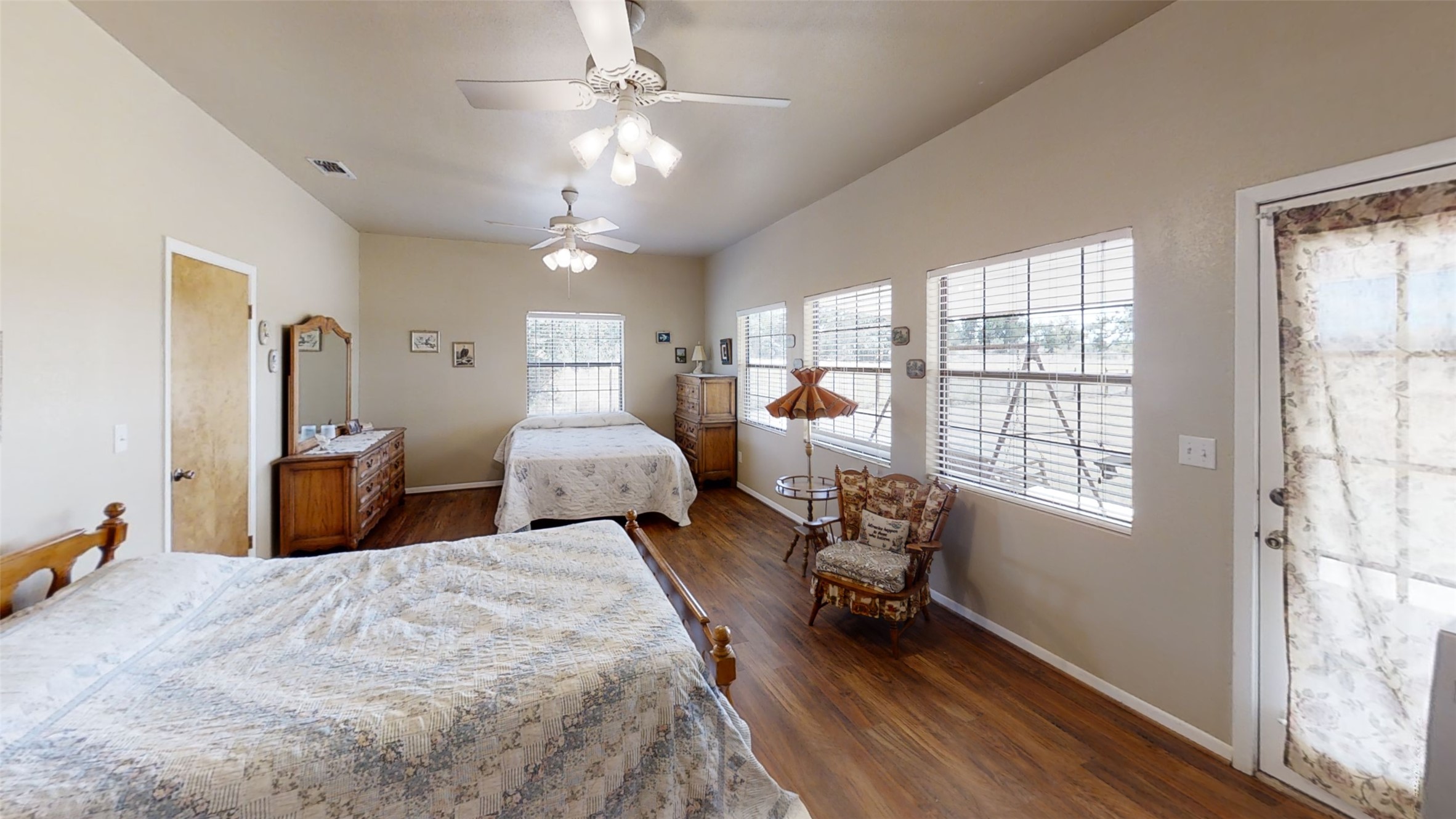 313 Rawhide Road Burnet, TX 78611 - Photo 13 of 17 a bedroom with two beds and a chandelier