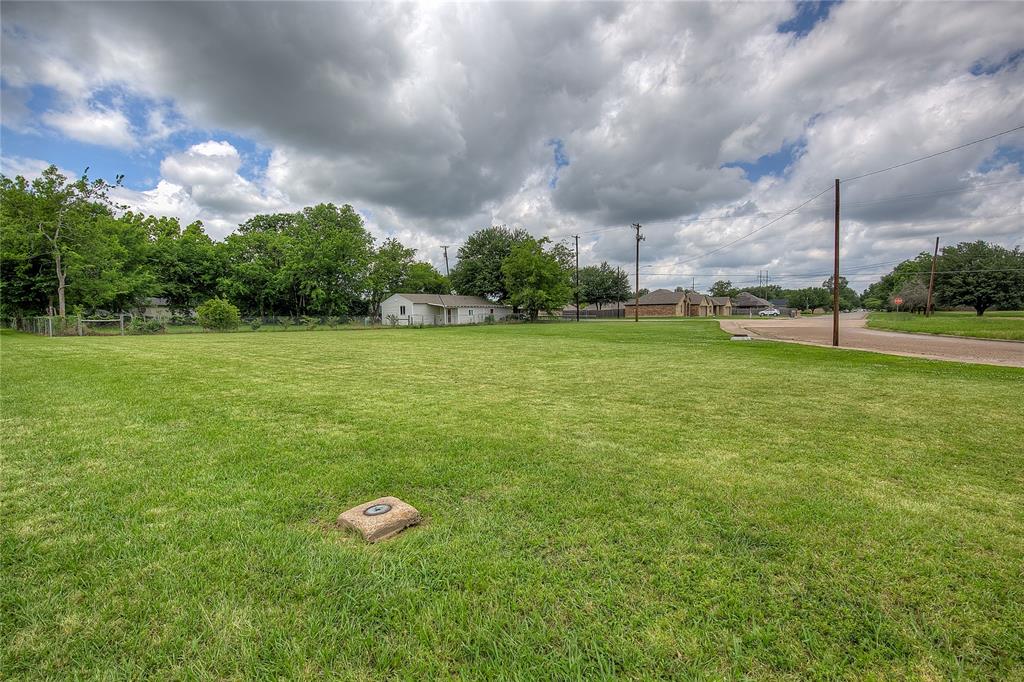 Tbd Washington Street Commerce, TX 75428 - Photo 9 of 13 a view of a big yard with a fountain