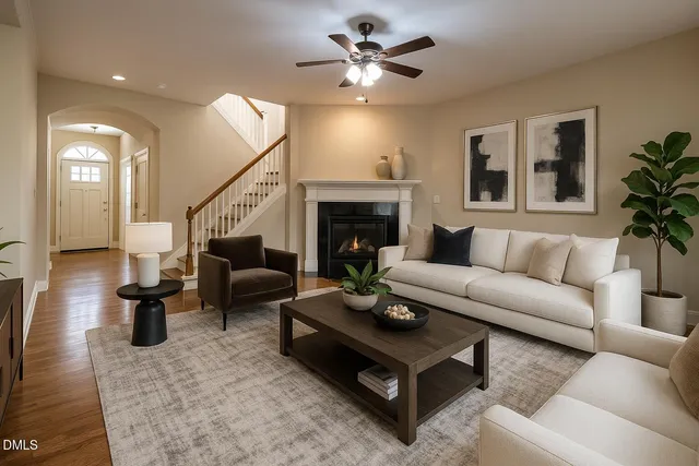 a living room with furniture and a fireplace