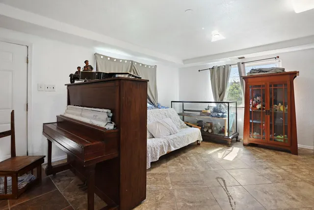 a bedroom with furniture and window