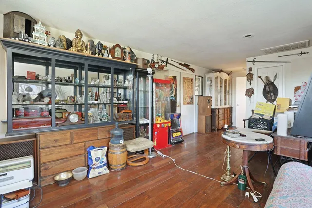 a living room with furniture a window and chairs