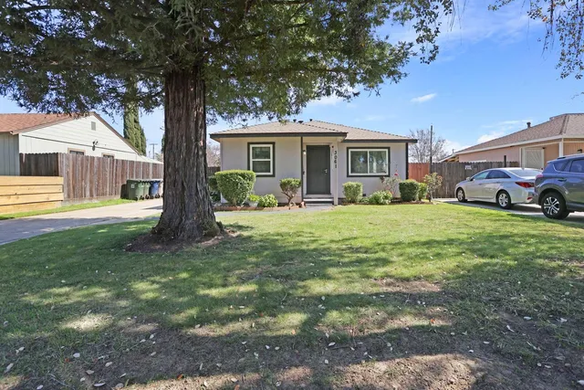 a front view of a house with a yard porch and sitting area