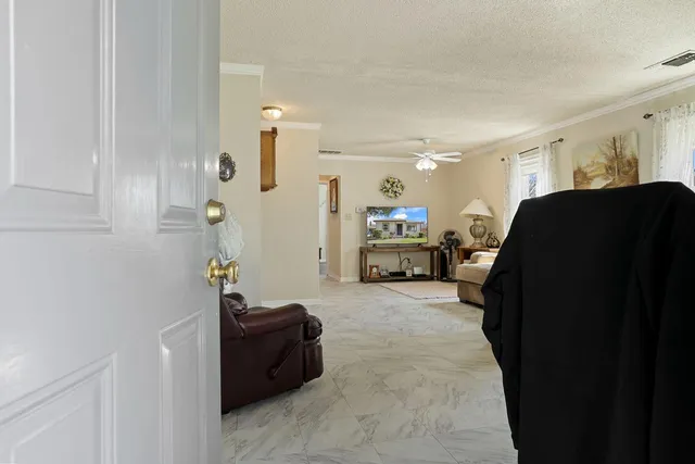 a living room with furniture and a mirror