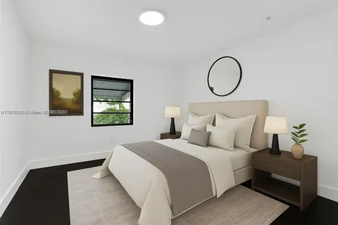 a bedroom with bed and a window