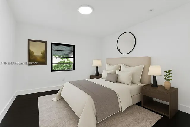 a bedroom with bed and a window