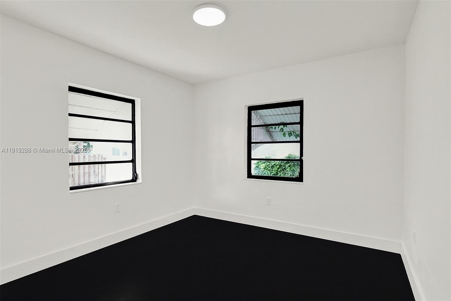 9173 Byron Avenue Surfside, FL 33154 - Photo 14 of 26 an empty room with a window