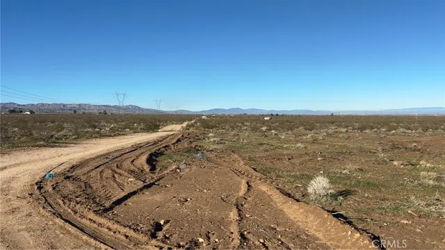 a view of an ocean beach and mountain