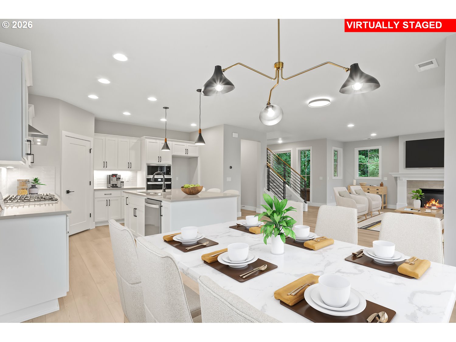 7321 Southwest Windflower Street Wilsonville, OR 97070 - Photo 7 of 20 a kitchen with stainless steel appliances kitchen island granite countertop a stove and white cabinets