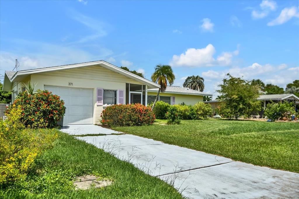 371 Peppertree Road Venice, FL 34293 - Photo 1 of 1 a front view of a house with a yard
